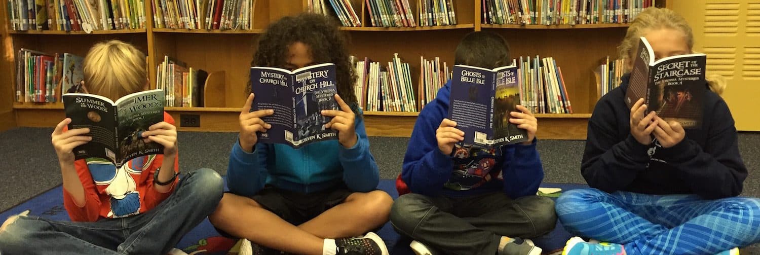 Students reading The Virginia Mysteries books during a classroom read-aloud